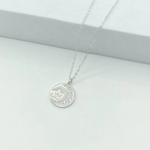 S925 sterling silver necklace featuring a star and moon medallion pendant with crystals