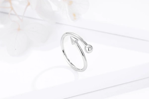 Detail of adjustable s925 silver ring featuring geometric arrow and bead design elements