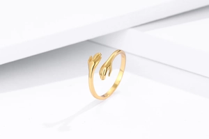 Close-up of S925 hallmark on gold plated hugging hands adjustable open ring