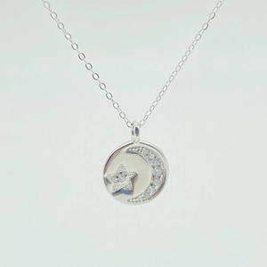 S925 sterling silver necklace featuring moon and star pendant with sparkling cubic zirconia
