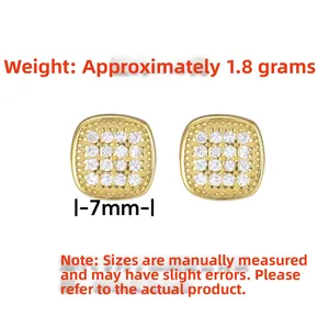 Detail view of 7mm gold square stud earrings with pave zircon and beaded edge detailing