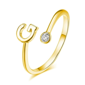 Macro shot of 925 sterling silver golden letter G ring featuring a sparkling zircon stone