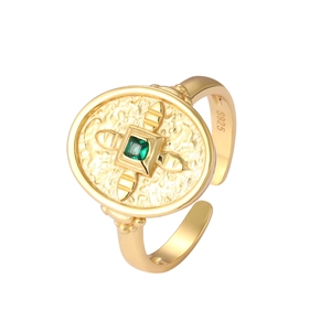 Detailed macro view of S925 sterling silver stamp and green zircon shield setting