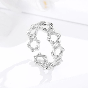 Polished silver cutout ring featuring interlocking Star of David pattern and open band