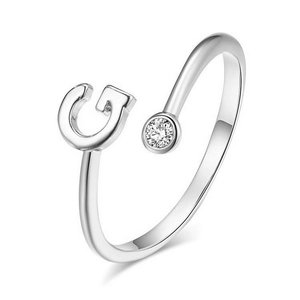 Adjustable sterling silver ring with letter G design and round cubic zirconia stone