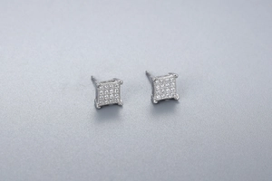 Macro shot of square S925 sterling silver stud earrings with micro-pave zirconia settings