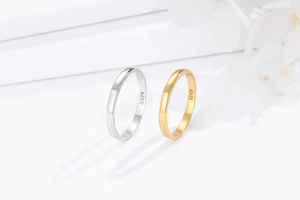 Macro view of polished S925 sterling silver rings with interior material hallmark stamp
