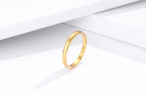 Detailed macro view of S925 hallmark on minimalist polished gold silver ring