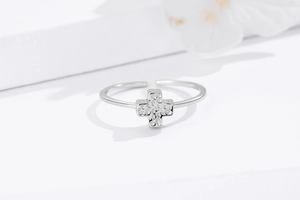 Detailed close-up of adjustable 925 sterling silver ring with hammered cross design