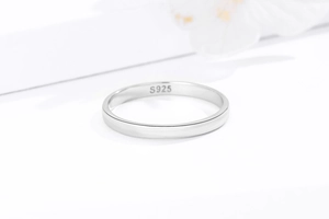 Close-up of S925 sterling silver stamp on minimalist polished couple ring interior