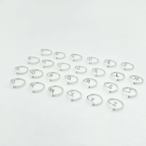 Detailed full set of 26 925 sterling silver initial rings with zircon accents on white base