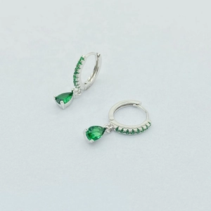 Detail of S925 silver hoop earrings featuring pear-cut green gemstones and micro-pave crystals