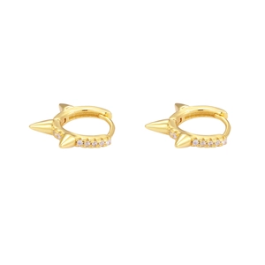 Macro detail of gold-plated punk hoop earrings with rivets and pavé zircon stones