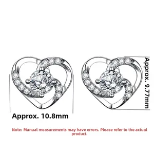 Macro shot of S925 silver double heart stud earrings with cubic zirconia and dimensions