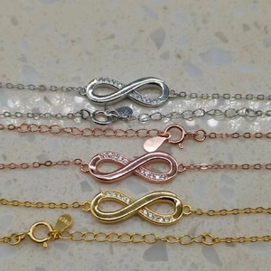 S925 sterling silver infinity bracelets set with cubic zirconia in three colors