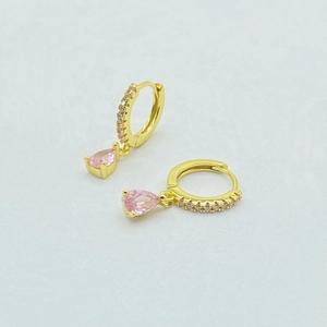 Detail of S925 silver drop earrings with pink zircon stones and gold plating