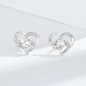 Elegant S925 sterling silver hollow heart stud earrings with sparkling round center stone