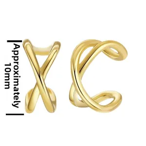 Detail of 10mm matte gold X-shaped cross and double line cuff earrings set