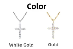 Close-up of gold and silver plated cross necklaces with sparkling pavé cubic zirconia
