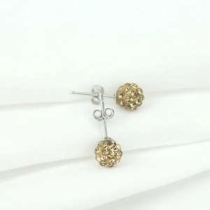 S925 sterling silver ball stud earrings with champagne crystals on white fabric