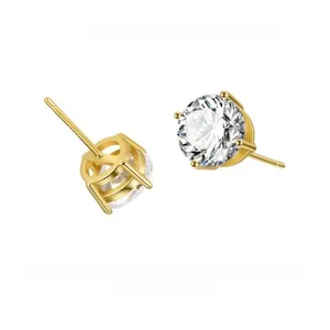 Macro view of classic six-prong gold plated stud earrings with sparkling round cut zircon