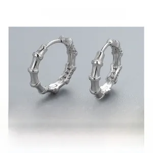 Detail shot of bamboo style S925 sterling silver earrings with glossy finish and hallmark