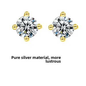 Detail view of classic four-prong sterling silver stud earrings with round zircons