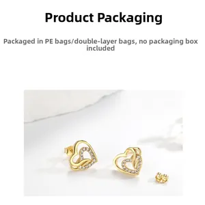 Detail view of heart-shaped 925 silver gold studs with zircon pavé and butterfly backs