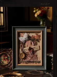 Detail of vintage collage frame with 3D butterfly embroidery and lace embellishments