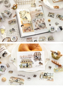 Detail of cat cafe washi tape featuring hand-drawn black cats and coffee cart illustrations