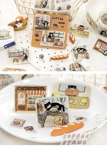 Detailed view of cat cafe theme washi tape with black cat and bakery collage patterns