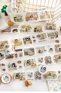 Detailed close-up of cat cafe themed washi tape with cute black cat bakery illustrations