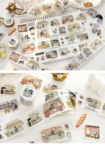 Close-up of cat cafe themed washi tape with hand-drawn coffee shop scenery for DIY journaling