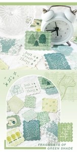 Macro detail of forest-themed stamp stickers with embossed green trees and botanical art