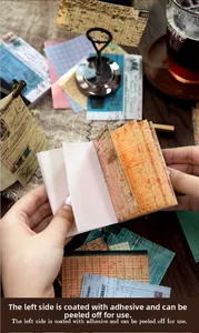 Detail of vintage paper sticker book with glue-bound edge for easy tearing and scrapbooking