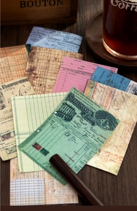 Macro shot of vintage scrapbooking papers with retro bills and old newspaper designs