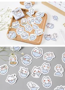Detail of cute cat stickers in bowls for DIY planners with decorative gift box packaging