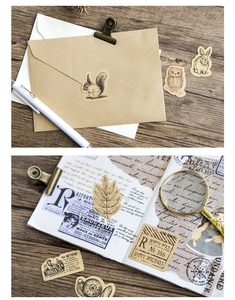 Macro view of vintage forest animal stickers on a kraft envelope and notebook