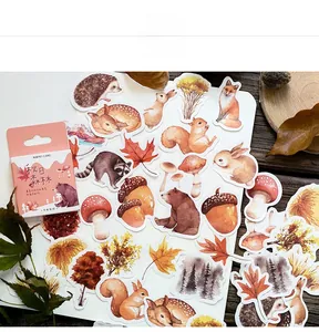 Close-up of autumn forest stickers featuring foxes, squirrels, and mushrooms for journaling