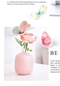 Pink striped ceramic mini vase with peach flowers on aesthetic journal background