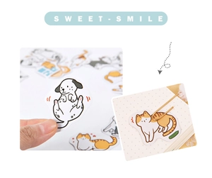 Detail of cartoon animal stickers being applied to a notebook with creative layouts