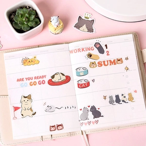 Cat-themed scrapbook journal set with adorable feline stickers and weekly planner layout