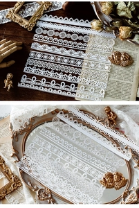 Detailed view of white lace hollow stickers with floral patterns for DIY scrapbooking decor