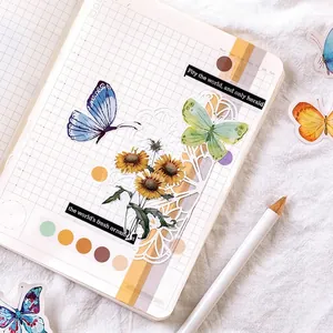Scrapbook sticker set featuring realistic butterflies and sunflowers on grid notebook