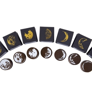 Retro wooden moon phase stamps set with white lunar cycle patterns and gold foil boxes