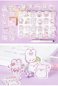 Detail of cute rabbit stickers set with pink storage box for DIY planner decorating