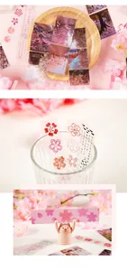 Scenic cherry blossom PET stickers for journaling and gift wrapping on wooden display