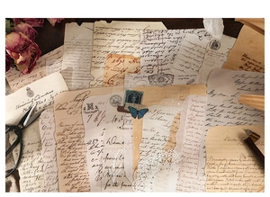 Detailed view of vintage junk journal supplies with lace paper and retro ephemera stickers