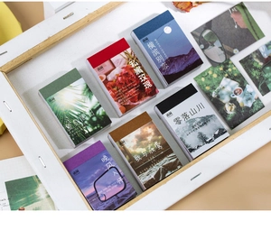 Détail de carnets d'autocollants paysagers vintage avec couvertures esthétiques pour scrapbooking