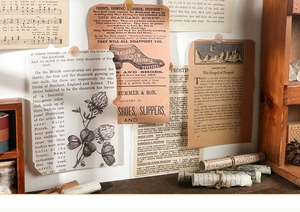 Close-up of vintage scrapbook paper with old advertisements and botanical illustrations